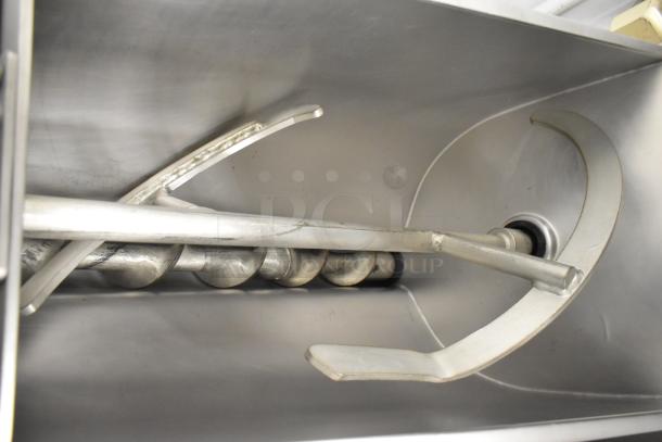 Hobart MG2032 meat mixer grinder interior with auger visible, made of stainless steel, commercial use.