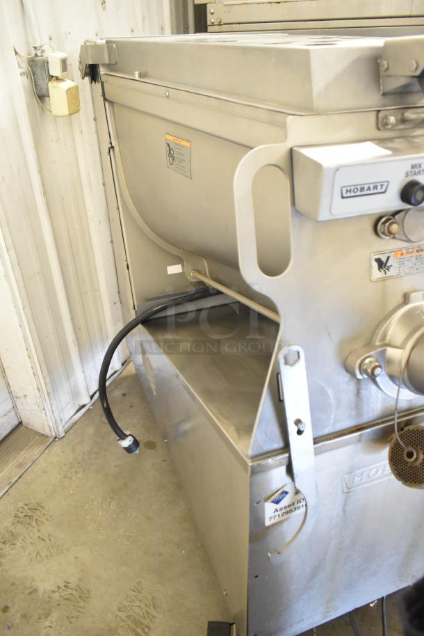 Hobart MG2032 commercial meat mixer grinder, stainless steel, with foot pedal and casters. 208V, 3-phase, excellent condition.