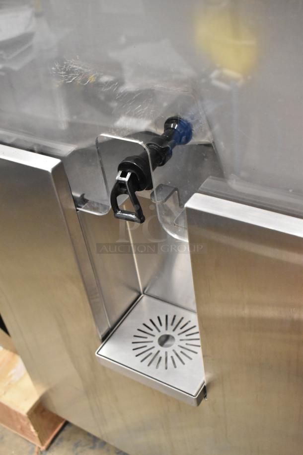 Stainless steel citrus juicer by JBT, model 2ND-GEN-MFJ-HE, on commercial casters. Floor style, 120V, 1 phase.