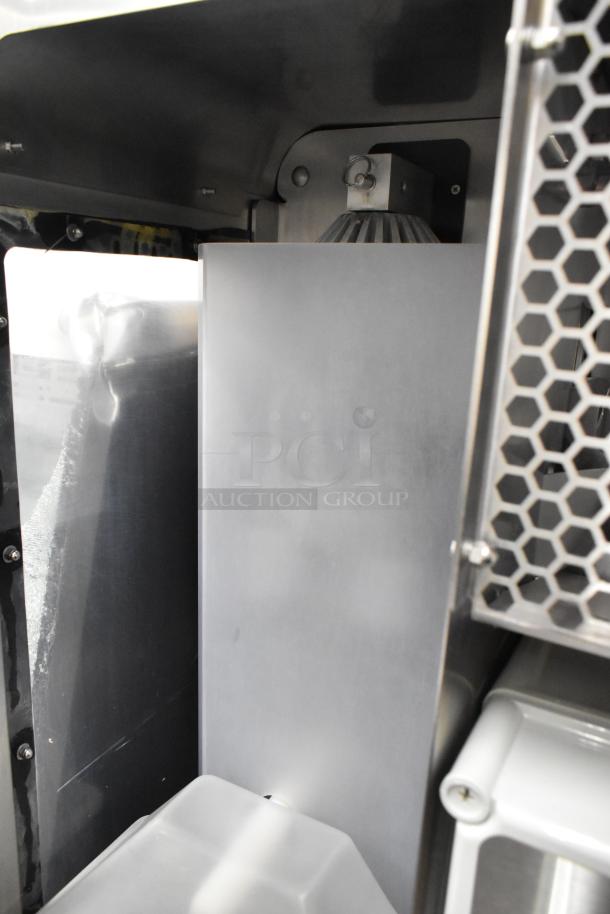 JBT 2nd-Gen-MFJ-HE stainless steel commercial citrus juicer, floor style on casters, 120V, 1 phase, robust condition.