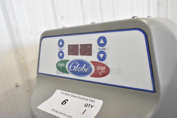 2023 Globe SPC40 commercial mixer control panel; features start/stop buttons. Includes mixing bowl, guard, and attachments.