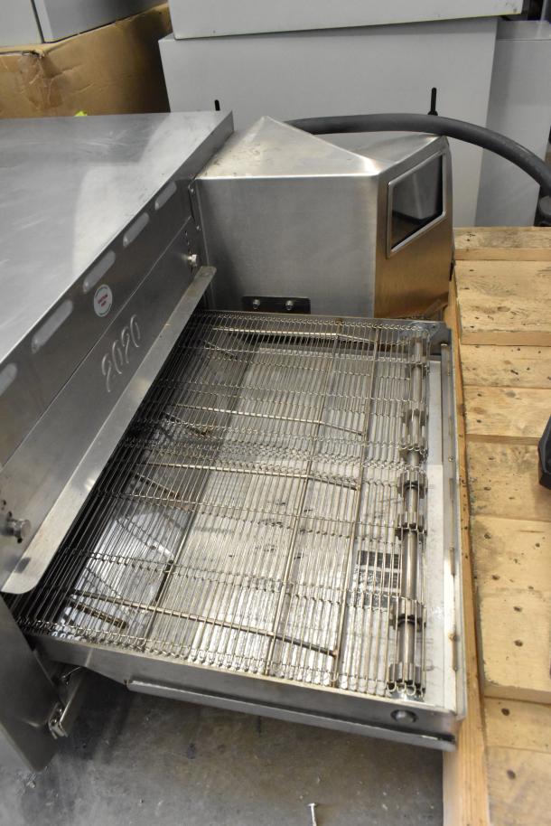 2024 Turbochef HhC2020 conveyor oven, electric, 208/240V, 3 phase. Stainless steel with visible grid and model marking.