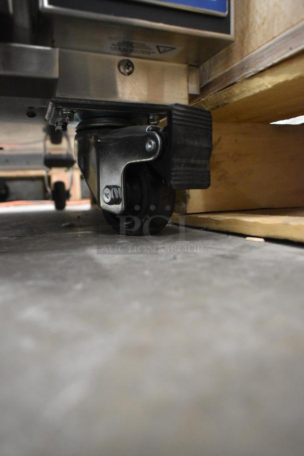 Moffat P8M Turbofan heated cabinet caster view, showing sturdy commercial caster and underside details.