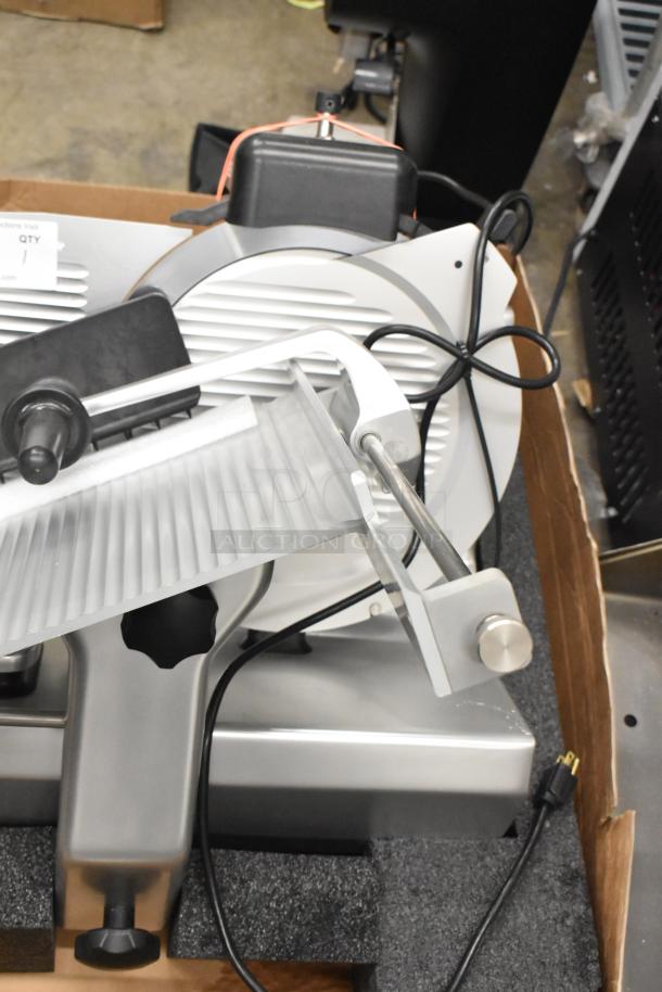 Brand new Globe SG13A-24 automatic meat slicer with 13" blade, blade sharpener, 110V, 1 Phase, in packaging.