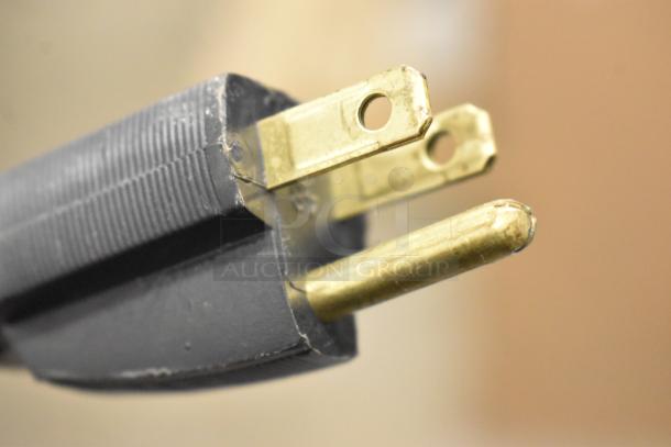 Close-up of a three-prong plug for the Globe SG13A-24 commercial countertop slicer. Brand new, 110 volts, 1 phase.