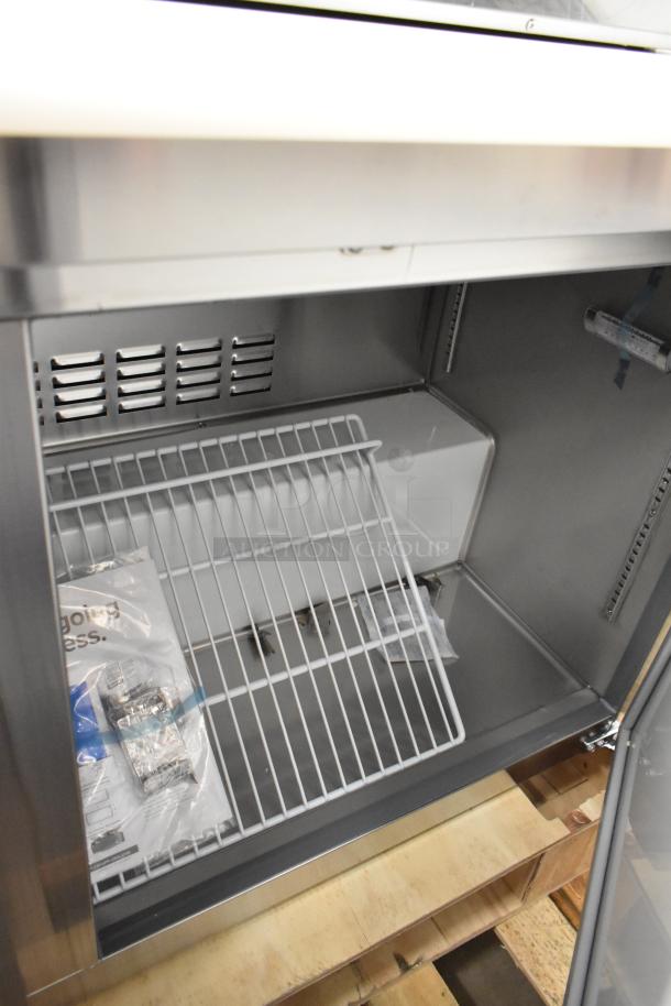 Brand new Avantco 178APT60HC commercial sandwich prep table, scratch and dent, 115V, 1 phase, interior view with wire shelf.