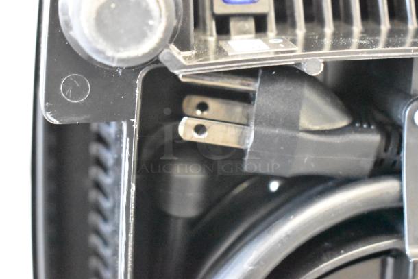 New 2025 Vita-Mix VM0101D countertop blender showing a close-up of the plug and cord storage. 120V, 1 Phase. Scratch and dent condition.