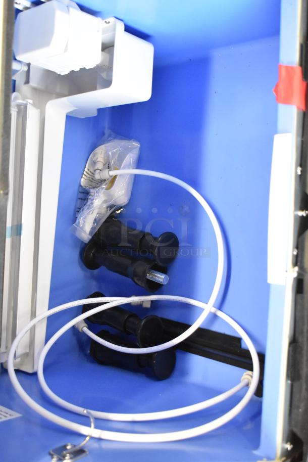 Stainless steel components and wiring inside Avantco 194UCF280A commercial ice machine showcasing installation features.