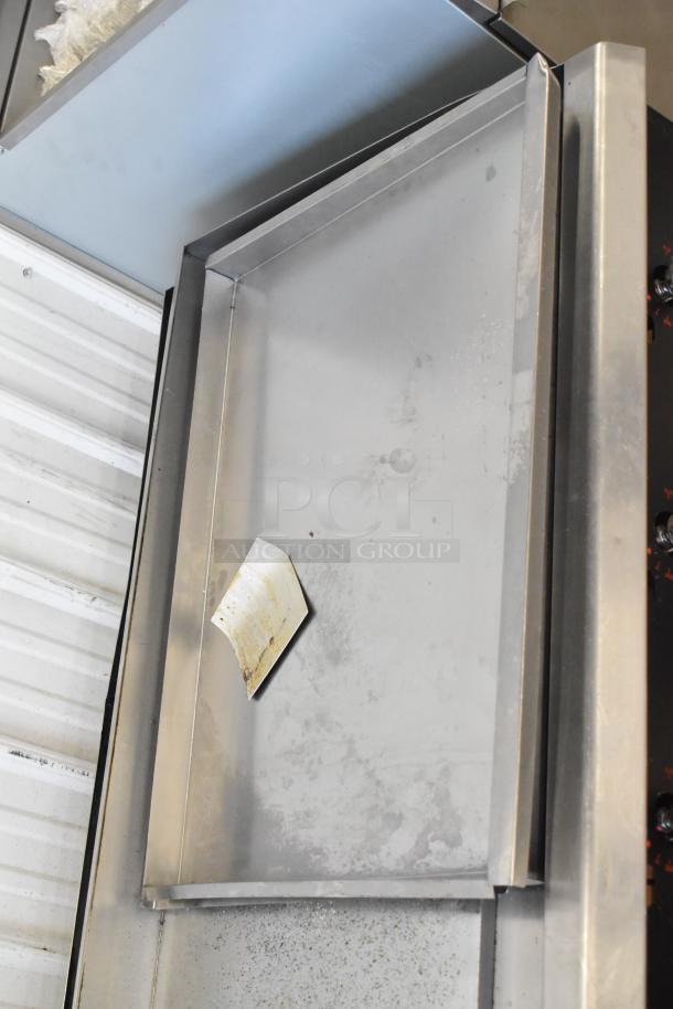 BRAND NEW Cooking Performance Group gas griddle, countertop model with thermostatic controls. Scratch and dent condition.