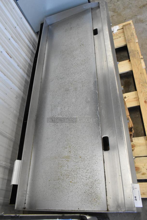 BRAND NEW SCRATCH AND DENT Cooking Performance Group countertop gas griddle with thermostatic controls, stainless steel top.