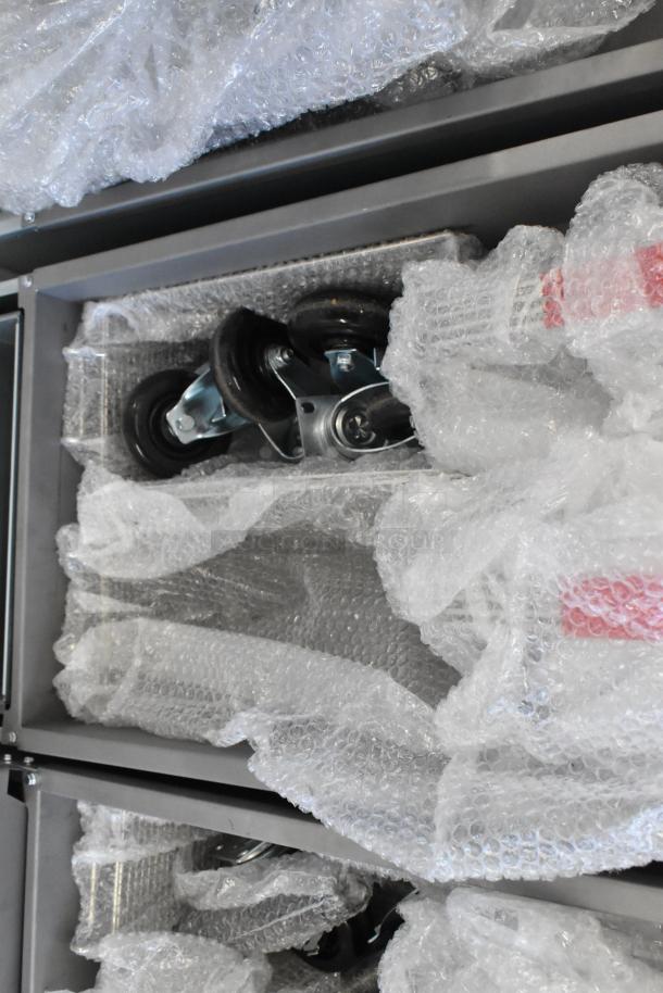 Avantco 177FF50L deep fat fryer parts wrapped in bubble wrap, showing wheels. New condition, propane gas, 120,000 BTU.