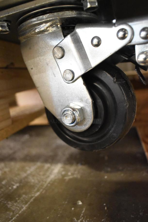 Close-up of a caster wheel on a 2025 Avantco 178CBE52HC commercial chef base. Brand new with scratch and dent.