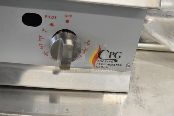 Brand new Cooking Performance Group 351GTCPG24NL flat top griddle. Natural gas, 60,000 BTU, thermostatic controls. Scratches visible.