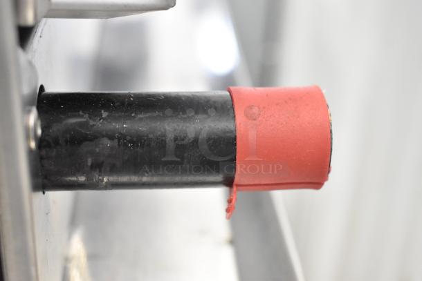 Close-up of the gas control knob on a Cooking Performance Group CPG 351GTCPG24NL commercial griddle.