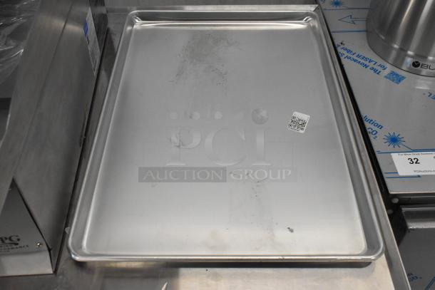 Brand new Vollrath 9001 Wear-Ever full-size aluminum sheet pan. Some scratch and dent. QR code visible on surface.