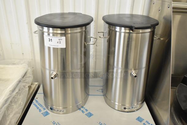 Two brand new Bunn TDO-4 iced tea/coffee dispensers, stainless steel, minor scratches, labels indicating quantity times two.