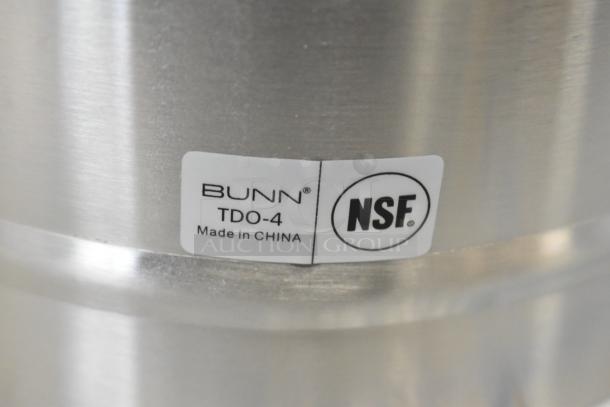 Bunn TDO-4 iced tea/coffee dispenser, brand new with minor scratches. NSF certified, made in China label visible.