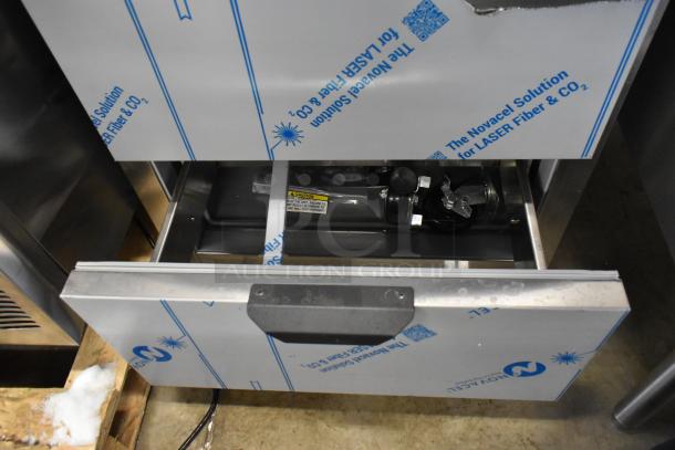 Beverage Air stainless steel 2-drawer undercounter cooler, new with scratches. 115V, 1 phase. Protective wrap visible.