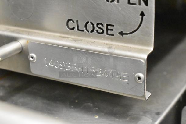 Engraved metal plate on Hardt Inferno 3500 rotisserie oven showing serial number 140935H15341AE.