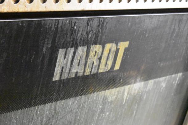 Hardt Inferno 3500 rotisserie oven close-up, showing brand name on metal surface, indicating commercial use.