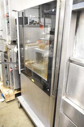 Fri-jado TDR7-P commercial rotisserie oven on casters, electric-powered, stainless steel finish, 208V, 3-phase, excellent condition.