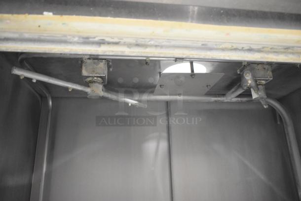 Douglas SD-20-ELEL commercial pot and pan washer interior, showing stainless steel spray arms and piping, used condition.