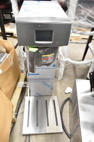 Brand new 2023 Fetco TBS-2121 commercial countertop iced tea machine, 120 volts, 1 phase, with visible scratch and dent.
