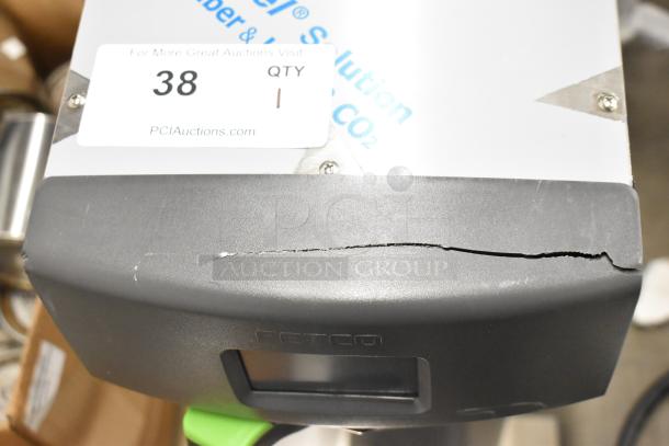 2023 Fetco TBS-2121 iced tea machine; new, with visible scratch and dent. Model label, power specs included.