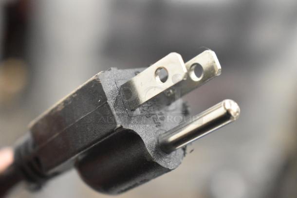 Close-up view of a power plug for the 2023 Fetco TBS-2121 Commercial Iced Tea Machine, 120 Volts, 1 Phase.