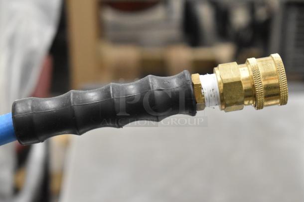 Brand new Regency Hose on Reel, blue hose, brass fittings, slight scratches and dents, durable rubber handle.