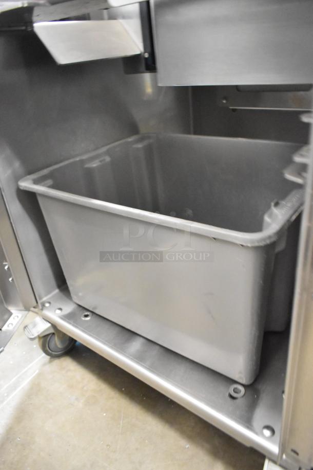 Commercial citrus juicer by JBT, model 2ND-GEN-MFJ-HE, in metal casing with sturdy commercial casters.