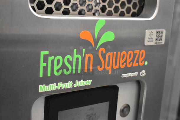 LATE MODEL JBT 2ND-GEN-MFJ-HE Fresh N Squeeze commercial citrus juicer on casters, 120V, with vibrant logo details.