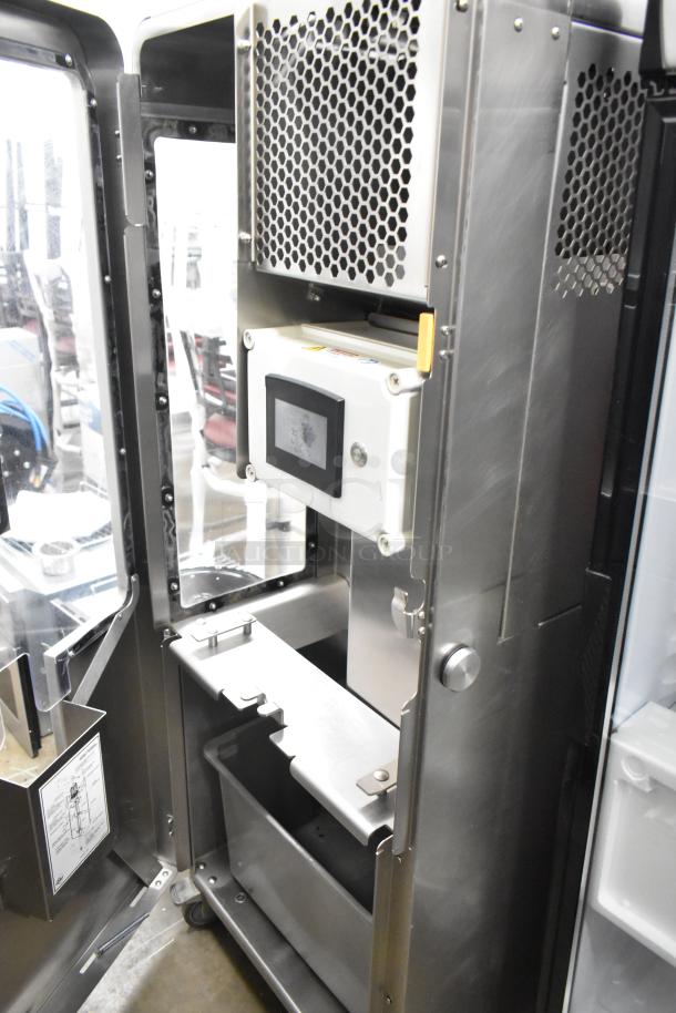 JBT 2ND-GEN-MFJ-HE commercial citrus juicer with control panel, stainless steel design, on casters, 120V, excellent condition.