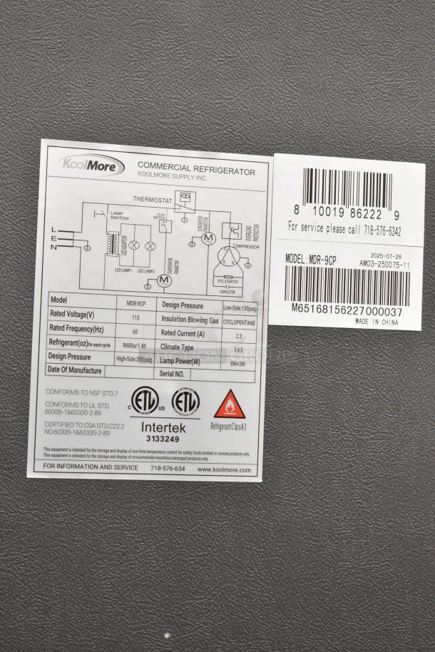 KoolMore MDR-9CP Refrigerator label showing model, voltage, refrigerant type, compliance certifications, and contact info.