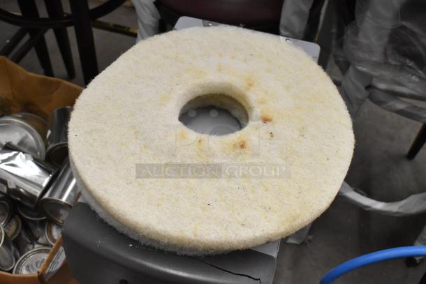 Round cleaning pad with minor stains, part of a "ALL ONE MONEY!" lot with vacuum head and dispenser. Condition: Used.