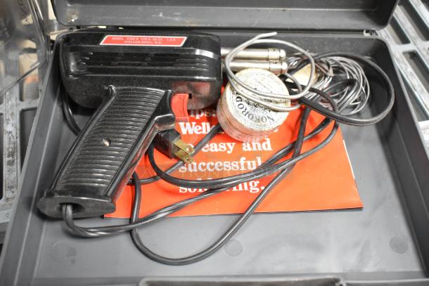 6 various tools including Well 8200N soldering gun, sharpening stones, probe kit with LAE control, and accessories.