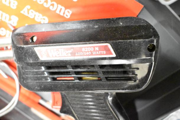 Weller 8200N Soldering Gun, 100/140 Watts, shown with ID label. Part of a lot with sharpening stones and probe kit.
