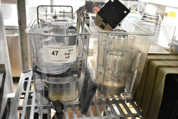 Lot of clear poly bins and lids with various sizes and shapes, labeled "47 QTY Tier lot" from PCIAuctions.com, in used condition.