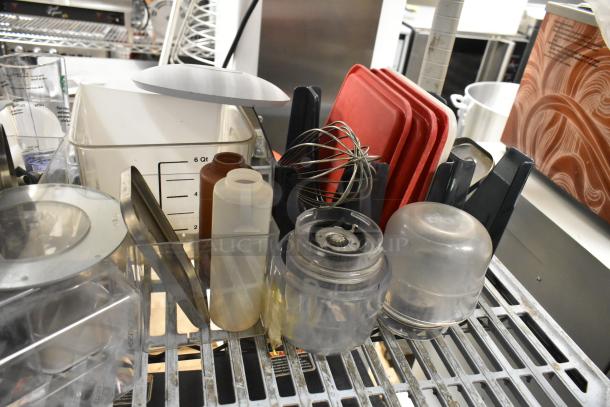 Lot of clear poly bins with lids, various sizes and shapes, marked up to 6 qt. Includes red lids and mixing whisk. Good condition.