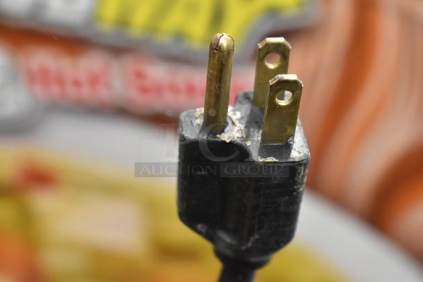 Close-up of a 3-prong plug from a Duke CSW-2-T-AM countertop 2 well food warmer, 120 volts, 1 phase.