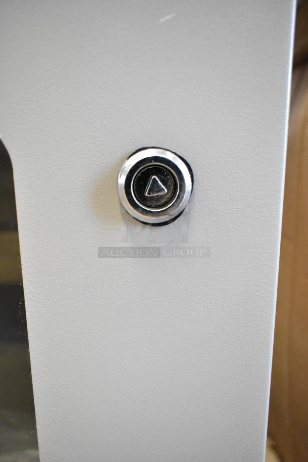 BlackShields DC0300 white metal air-conditioned cabinet with a sleek button feature, new condition.