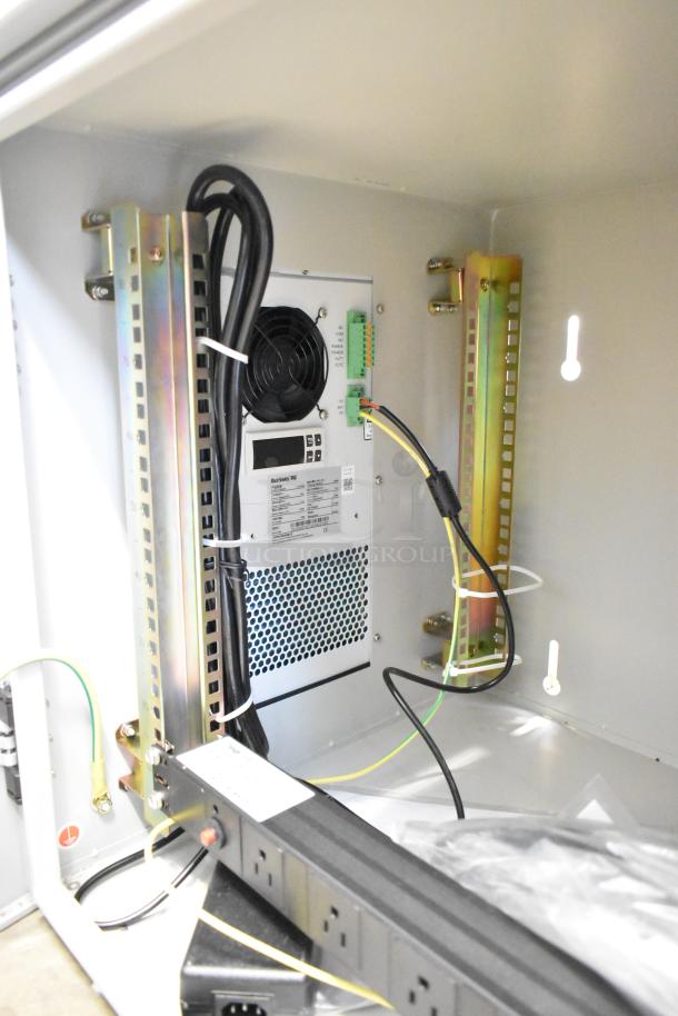 BlackShields DC0300 white metal technology cabinet, featuring air conditioning, power strip, and internal wiring; model labels visible.