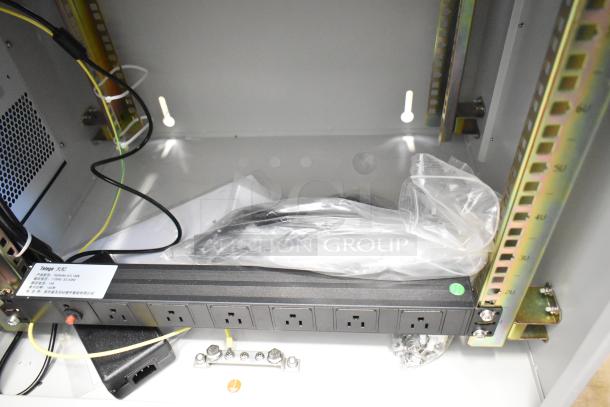 BlackShields DC0300 white metal air-conditioned tech cabinet interior, featuring power outlets and wiring. New condition.