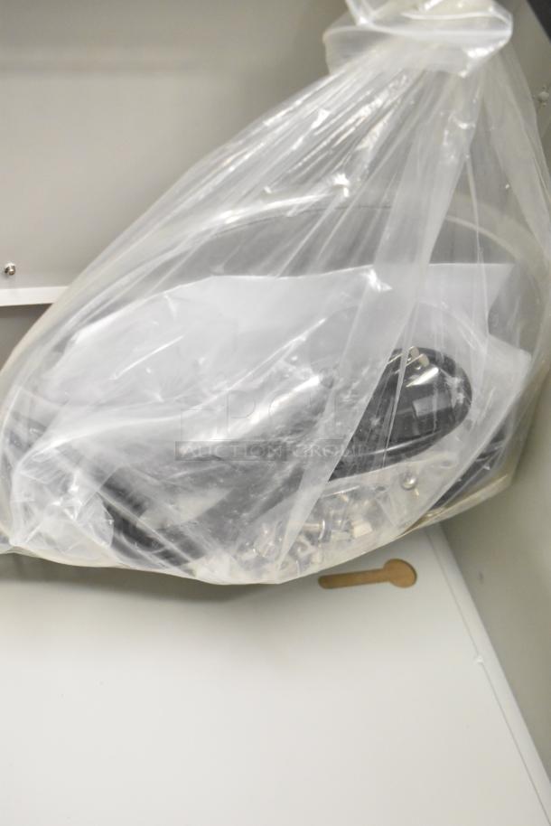 Brand new BlackShields DC0300 white metal air-conditioned cabinet, scratch and dent condition, no key, contents in plastic bag.