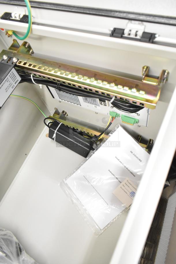 Brand new BlackShields DC0300 white metal air-conditioned cabinet, internal view; scratch and dent condition, no key.