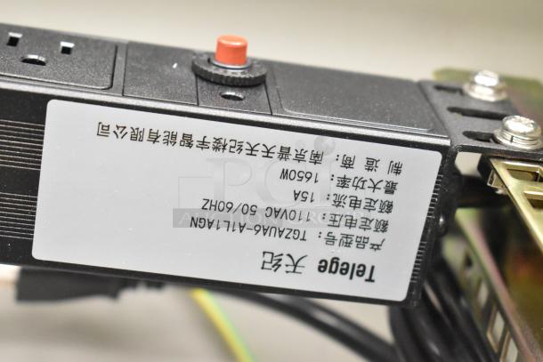 Close-up of a label on a BlackShields DC0300 cabinet part, showing technical specifications and text in a foreign language.
