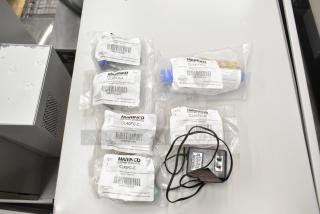 Lot of various items including Marinco CLS40FB-D pin connector, CL40FC-A/B/C/E protective caps, each in packaging.