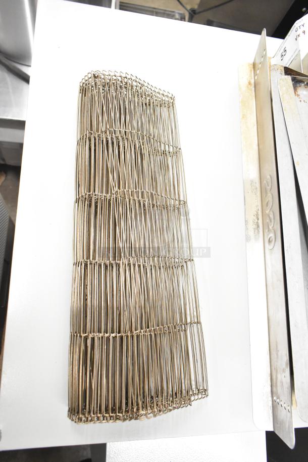 9 various metal components for Turbochef rapid cook conveyor ovens, includes a conveyor belt, in used condition.