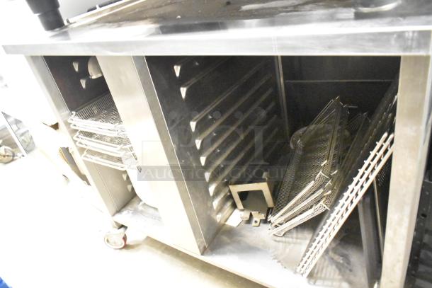 2019 Rational SCCWE62 SelfCookingCenter oven, electric-powered, on stand with casters, visible oven racks and interior.