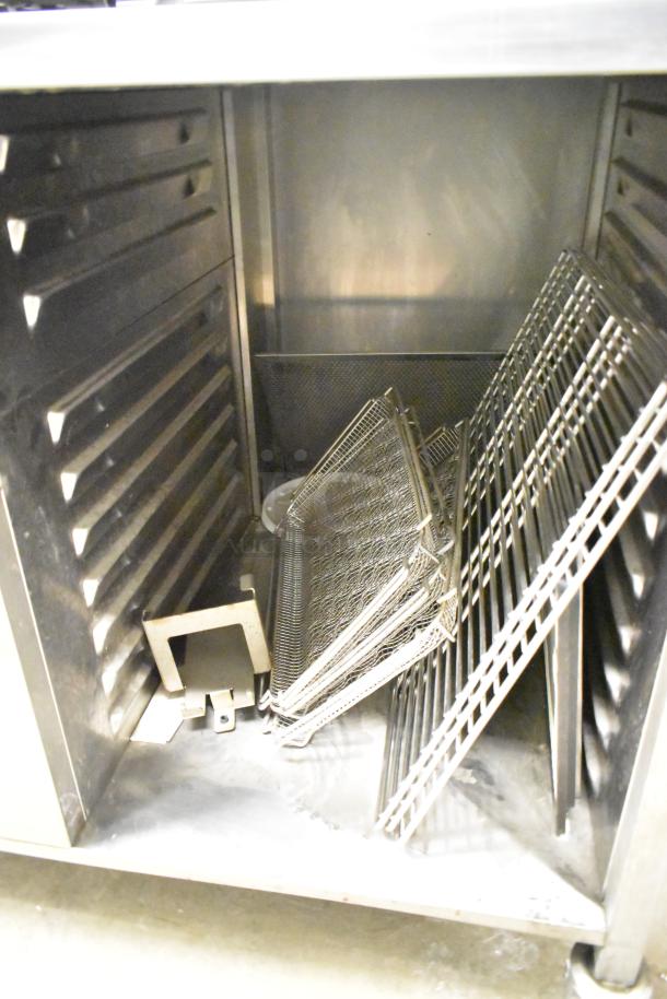 2019 Rational SCCWE62 convection oven interior with racks on equipment stand. Good condition, commercial-grade, 480V, 3 phase.